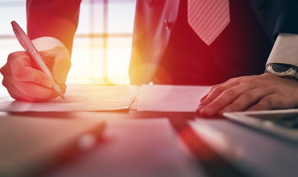 Close up businessman signing contracts